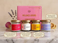 Mini soy wax candle from the AM to PM Collection lit on a bedside table
