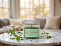 Peppermint soy wax candle infused with premium fragrance by Melange Aroma, displayed beautifully with fresh mint leaves on a clean, modern surface.